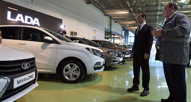 epa05118865 Russian Prime Minister Dmitry Medvedev (L) visits the AvtoVAZ automobile plant in Togliatti, Russia, 22 January 2016. Dmitry Medvedev announced that he had signed a decree to provide 50 billion roubles ( over 574.7 million euro ) as Government subsidies to support automotive industry in 2016.  EPA/ALEXANDER ASTAFYEV / SPUTNIK / GOVERNMENT PRESS SERVICE POOL MANDATORY CREDIT
